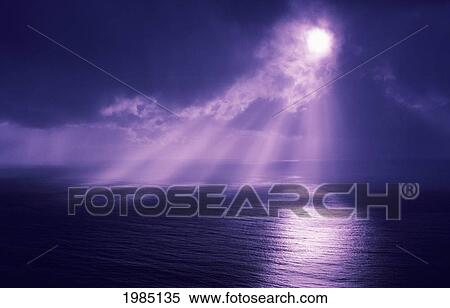 Stock Photography - Sunlight Bursting Through Dark Clouds.. Fotosearch