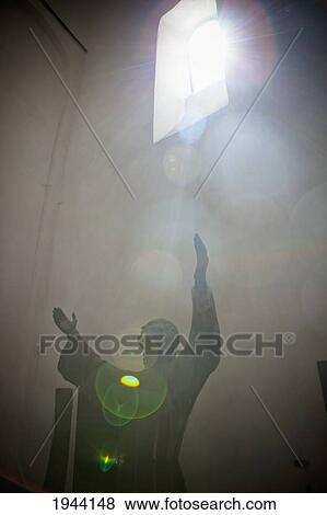 Sunlight Shining Through A Window Onto A Statue With Arms Raised; San Frutuozzo Liguria Italy View Large Photo Image Stock Photo - Sunlight Shining Through A Window Onto A Statue With Arms Raised; San Frutuozzo Liguria Italy. Fotosearch
