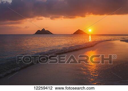 Stock Image - Sunrise at Lanikai Beach; Kailua, Island of Hawaii, Hawaii, United States of America. Fotosearch