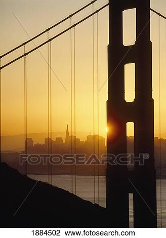 Stock Image - Sunrise Behind The Golden Gate Bridge With San Francisco Behind. Fotosearch