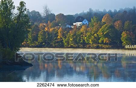 Picture - Sunrise Breaks Through The Fog On The Kennebec River; Gardiner Maine United States Of America. Fotosearch