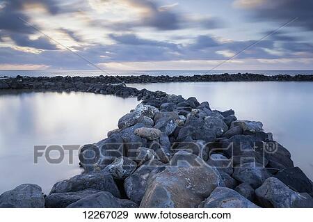 Stock Photo - Sunrise from Lydgate Beach Park; Lydgate, Kauai, Hawaii, United States of America. Fotosearch