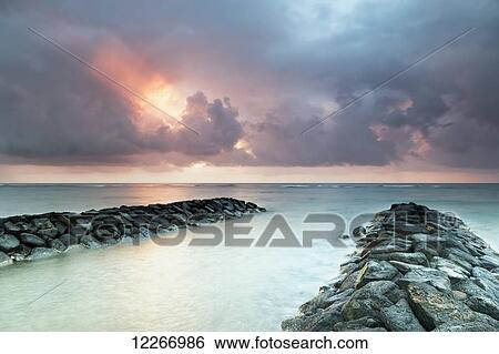 Sunrise in Kapaa looking out over breakwater; Kapaa, Kauai, Hawaii, United States of America View Large Photo Image Stock Photograph - Sunrise in Kapaa looking out over breakwater; Kapaa, Kauai, Hawaii, United States of America. Fotosearch