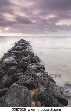Sunrise looking out over the breakwater; Kapaa, Kauai, Hawaii, United States of America View Large Photo Image Stock Photograph - Sunrise looking out over the breakwater; Kapaa, Kauai, Hawaii, United States of America. Fotosearch