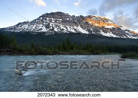 Sunrise On Mountain At Mosquito Creek, Banff National Park, Alberta, Canada View Large Photo Image Stock Image - Sunrise On Mountain At Mosquito Creek, Banff National Park, Alberta, Canada. Fotosearch