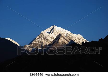 Stock Photograph - Sunrise On The Summits Above Namche Bazaar, Nepal. Fotosearch