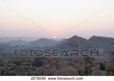 Stock Photograph - Sunrise On The Surreal Boulder Fields In Hampi, Karnataka, India. Fotosearch