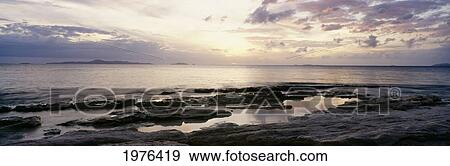 Sunrise Over Ocean And Rocky Coastline; Fiji View Large Photo Image Stock Photo - Sunrise Over Ocean And Rocky Coastline; Fiji. Fotosearch