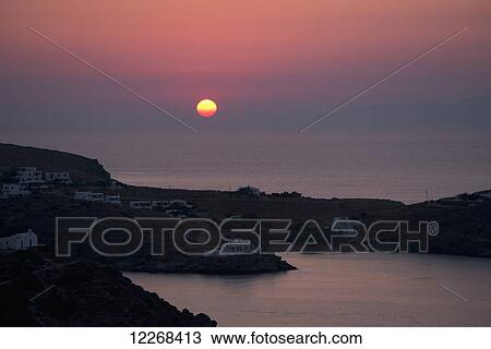Stock Image - Sunrise over Stavros Farou in Southeastern Sifnos; Sifnos, Cyclades, Greek Islands, Greece. Fotosearch