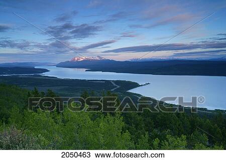 Stock Image - Sunrise Over The Teslin River, Yukon. Fotosearch