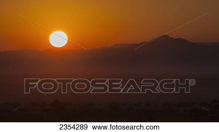 Sunrise With A Silhouette Of The Landscape; Namibia View Large Photo Image Stock Photo - Sunrise With A Silhouette Of The Landscape; Namibia. Fotosearch