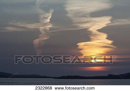 Stock Photo - Sunset at Reenard Point looking across to Valentia Island; Cahersiveen, Iveragh Peninsula, County Kerry, Ireland, UK. Fotosearch