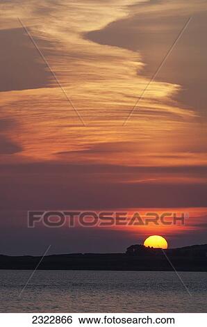 Stock Photograph - Sunset at Reenard Point looking across to Valentia Island; Cahersiveen, Iveragh Peninsula, County Kerry, Ireland, UK. Fotosearch