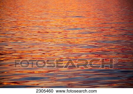 Stock Image - Sunset during late summer on west coast; Greenland. Fotosearch