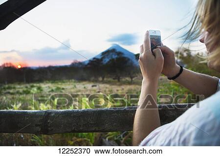 Stock Image - Sunset falls behind the Concepcion volcano on the Isla de Omatepe; Santa Cruz, Rivas, Nicaragua. Fotosearch