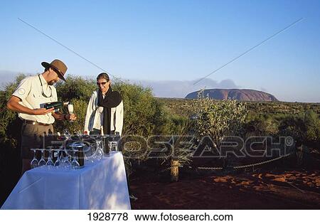 Stock Photo - Sunset From Dune Above Uluru. Fotosearch
