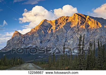 Stock Photo - Sunset glow on Sukakpak Mountain in Brooks Range, Dalton Hwy, Arctic Alaska, Autumn.. Fotosearch