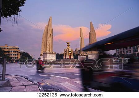 Stock Photograph - Sunset images around Bangkok's Democracy Monument. Fotosearch