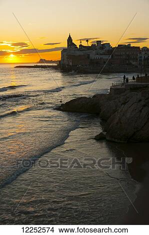 Sunset in the beautiful Sitges downtown, village near to Barcelona; Sitges, Spain View Large Photo Image Picture - Sunset in the beautiful Sitges downtown, village near to Barcelona; Sitges, Spain. Fotosearch