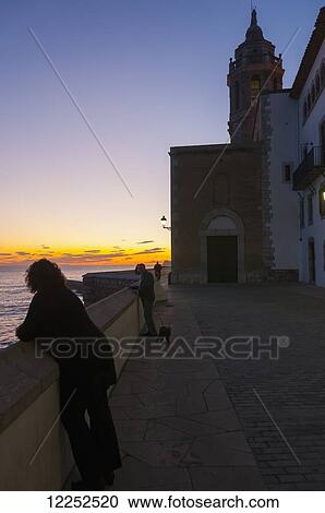 Stock Image - Sunset in the beautiful Sitges downtown, village near Barcelona; Sitges, Catalonia, Spain. Fotosearch
