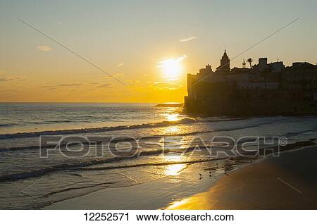 Sunset in the beautiful Sitges downtown, village near to Barcelona; Sitges, Spain View Large Photo Image Stock Image - Sunset in the beautiful Sitges downtown, village near to Barcelona; Sitges, Spain. Fotosearch