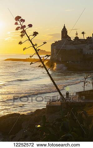 Stock Image - Sunset in the beautiful Sitges downtown, village near to Barcelona; Sitges, Spain. Fotosearch