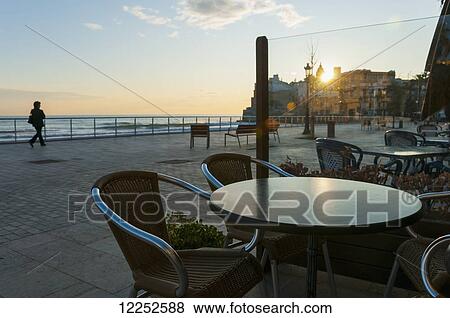 Stock Photo - Sunset in the beautiful Sitges downtown, a village near to Barcelona; Sitges, Spain. Fotosearch