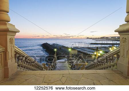 Sunset in the beautiful Sitges downtown, village near to Barcelona; Sitges, Spain View Large Photo Image Stock Photograph - Sunset in the beautiful Sitges downtown, village near to Barcelona; Sitges, Spain. Fotosearch