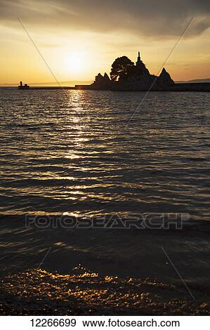 Stock Photo - Sunset in Trpanj; Croatia. Fotosearch