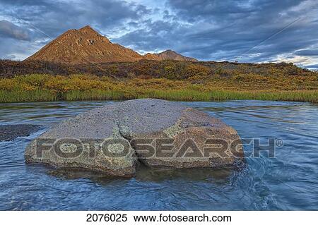 Stock Photography - Sunset Light Hitting Angelcomb Peak And Blackstone River Along Dempster Highway; Yukon Canada. Fotosearch