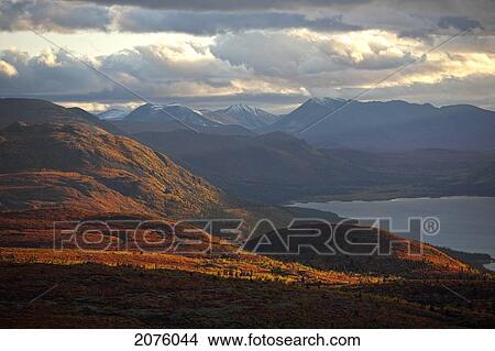 Sunset Light Over Mountains Around Fish Lake; Whitehorse Yukon Canada View Large Photo Image Picture - Sunset Light Over Mountains Around Fish Lake; Whitehorse Yukon Canada. Fotosearch