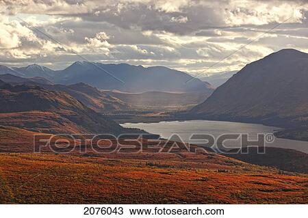 Stock Image - Sunset Light Over Mountains Around Fish Lake; Whitehorse Yukon Canada. Fotosearch