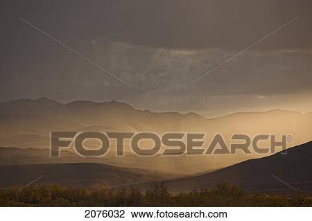Sunset Light Shining Through Rainfall Along The Dempster Highway; Yukon Canada View Large Photo Image Stock Image - Sunset Light Shining Through Rainfall Along The Dempster Highway; Yukon Canada. Fotosearch