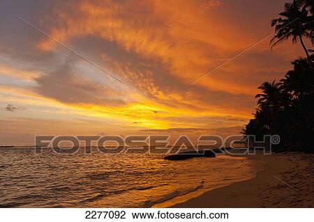 Stock Image - Sunset on beach, near Unawatuna; Thalpe, Sri Lanka. Fotosearch