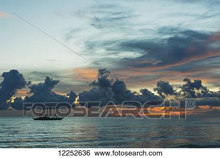Stock Photograph - Sunset on Borakay beach; Panay, Philippines. Fotosearch