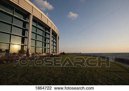 Stock Image - Sunset On Curved Building. Fotosearch