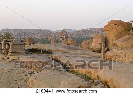 Sunset On Hemakuta Hill With Surreal Boulders And Virupaksha Temple In Background, Hampi, Karnataka, India View Large Photo Image Stock Image - Sunset On Hemakuta Hill With Surreal Boulders And Virupaksha Temple In Background, Hampi, Karnataka, India. Fotosearch