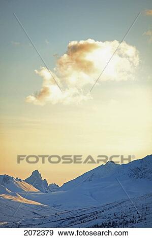 Sunset On Klondike Valley With Tombstone Mountain On The Horizon, Tombstone Territorial Park, Yukon, Canada View Large Photo Image Stock Photo - Sunset On Klondike Valley With Tombstone Mountain On The Horizon, Tombstone Territorial Park, Yukon, Canada. Fotosearch