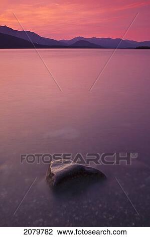 Sunset Over Atlin Lake In Atlin Provincial Park, British Columbia. View Large Photo Image Stock Image - Sunset Over Atlin Lake In Atlin Provincial Park, British Columbia.. Fotosearch