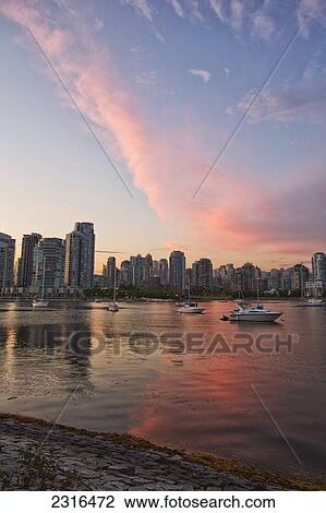 Stock Image - Sunset Over False Creek And City Skyline; Vancouver British Columbia Canada. Fotosearch