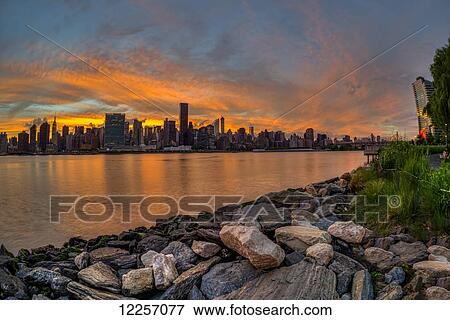 Sunset over Manhattan skyline, Gantry Plaza State Park, Queens; New York City, New York, United States of America View Large Photo Image Stock Photo - Sunset over Manhattan skyline, Gantry Plaza State Park, Queens; New York City, New York, United States of America. Fotosearch