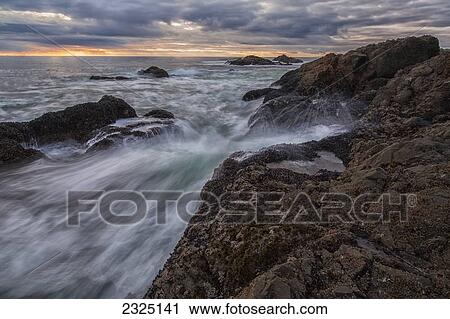 Sunset Over Ocean At Sunset And High Tide; Ucluelet Vancouver Island British Columbia Canada View Large Photo Image Stock Image - Sunset Over Ocean At Sunset And High Tide; Ucluelet Vancouver Island British Columbia Canada. Fotosearch