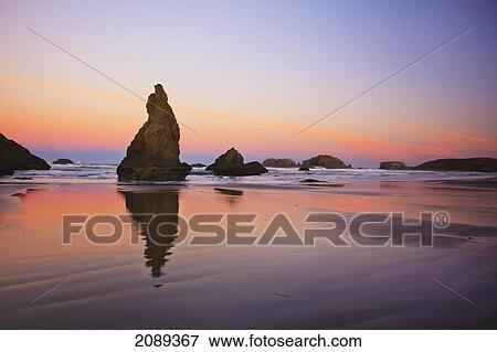 Sunset Over Rock Formations Reflecting In Tide Pools At Low Tide, Bandon Beach; Oregon, United States Of America View Large Photo Image Stock Photo - Sunset Over Rock Formations Reflecting In Tide Pools At Low Tide, Bandon Beach; Oregon, United States Of America. Fotosearch