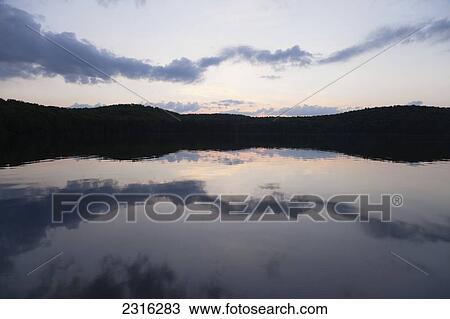 Stock Image - Sunset Over Smoke Lake In Algonquin Park; Ontario Canada. Fotosearch