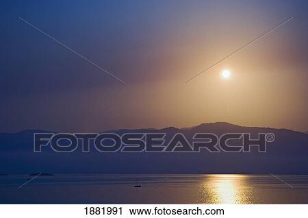 Sunset Over Some Of The Ionian Islands. View Large Photo Image Stock Image - Sunset Over Some Of The Ionian Islands.. Fotosearch
