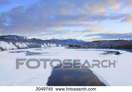 Stock Photography - Sunset Over Teslin River, Yukon. Fotosearch