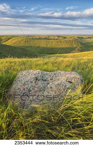 Picture - Sunset Over The Coulees And Buttes Of Grasslands National Park With Erratic In Foreground; Saskatchewan, Canada. Fotosearch