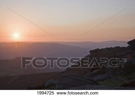 Sunset Over The Landscape Of Peak District National Park; Derbyshire England View Large Photo Image Stock Photography - Sunset Over The Landscape Of Peak District National Park; Derbyshire England. Fotosearch