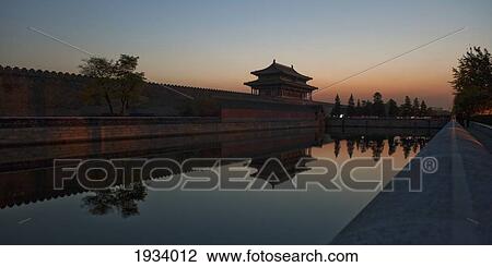 Stock Image - Sunset Over The Moat At Gate Of Divine Might In Forbidden City; Beijing, China. Fotosearch