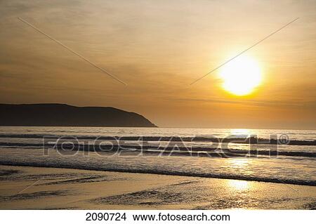 Picture - Sunset Over The Sea And Beach In Putsborough Sands, North Devon, Uk. Fotosearch